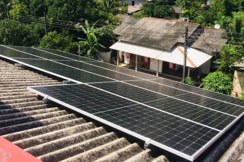 10 solar panels mounted on a corrugated roof at a house in Piliyandala